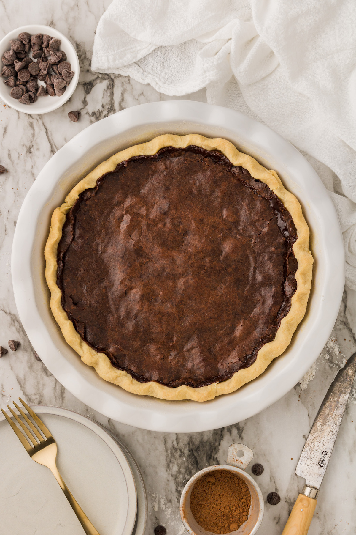 Overhead view of whole vegan chocolate chess pie in pie plate