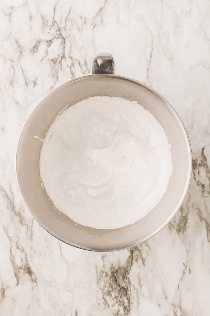 Overhead view of whipped aquafaba and sugar