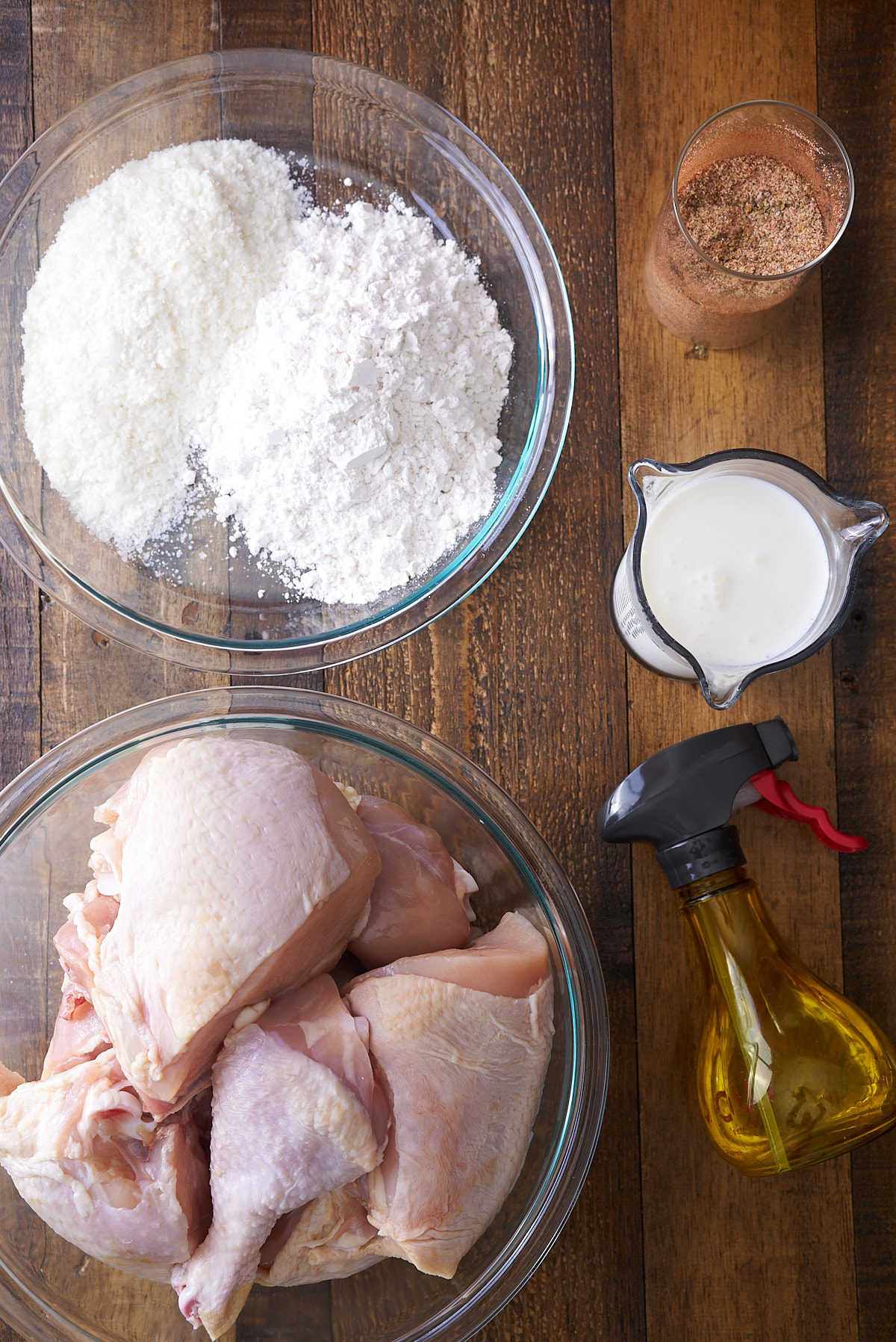 ingredients for oven fried chicken on wood table