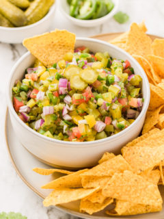Tortilla chips on serving platter with pickle de gallo in bowl