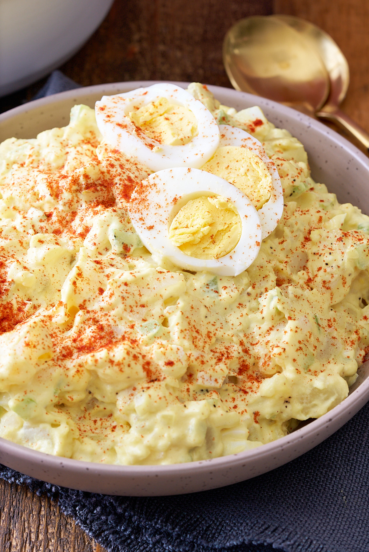 southern potato salad in bowl with eggs on top