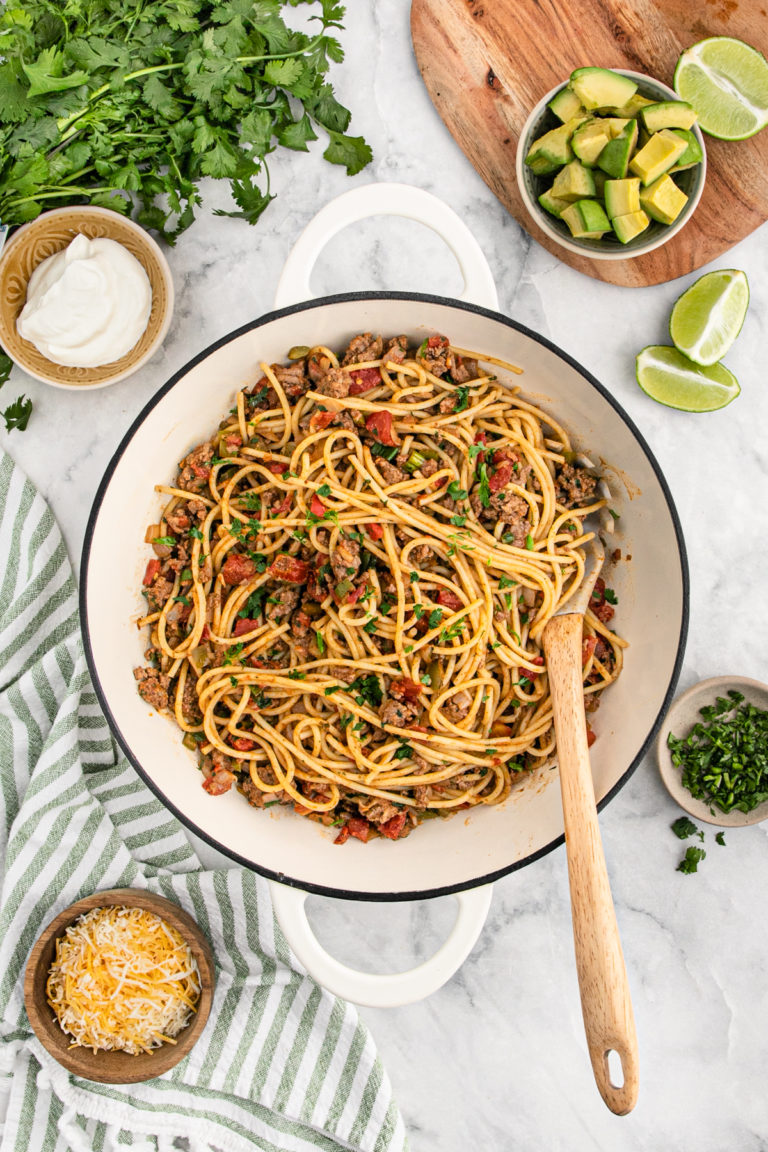 A taco spaghetti recipe in a large white pot ready to serve
