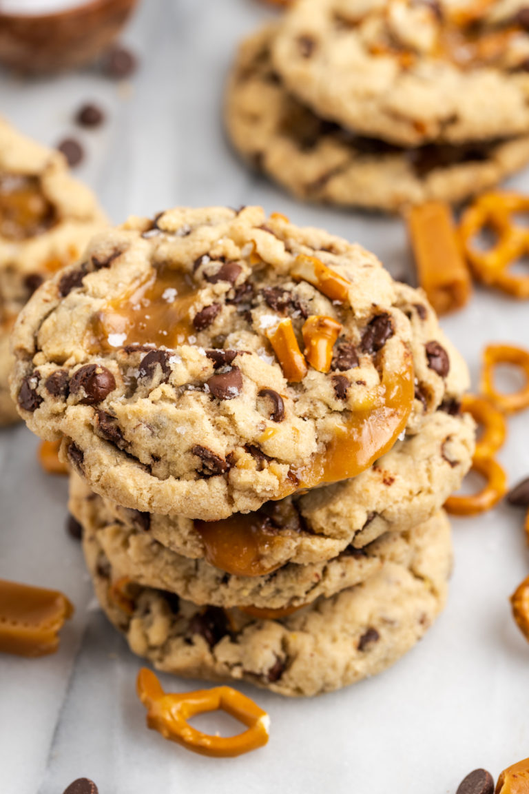 Stack of 4 kitchen sink cookies, with additional cookies in background