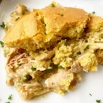 piece of cooked chicken cornbread casserole on a white plate