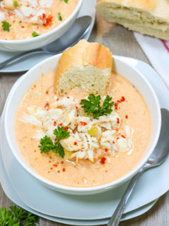 Diving into a decadent bowl of she crab soup with crusty bread