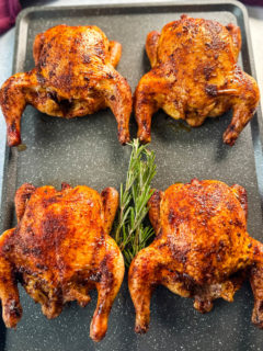 roasted and baked Cornish hens on a sheet pan