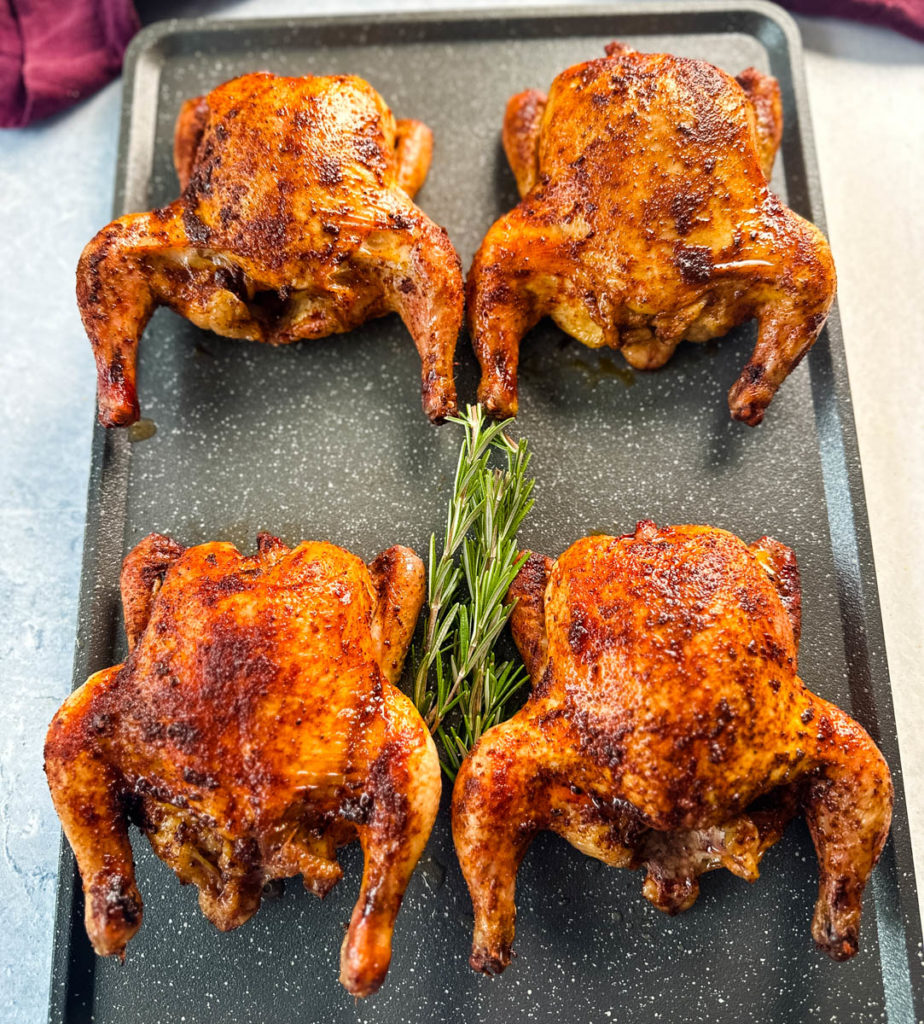 roasted and baked Cornish hens on a sheet pan