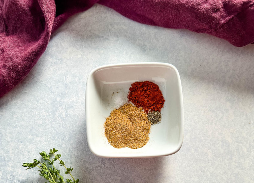chicken rub spices in a white bowl