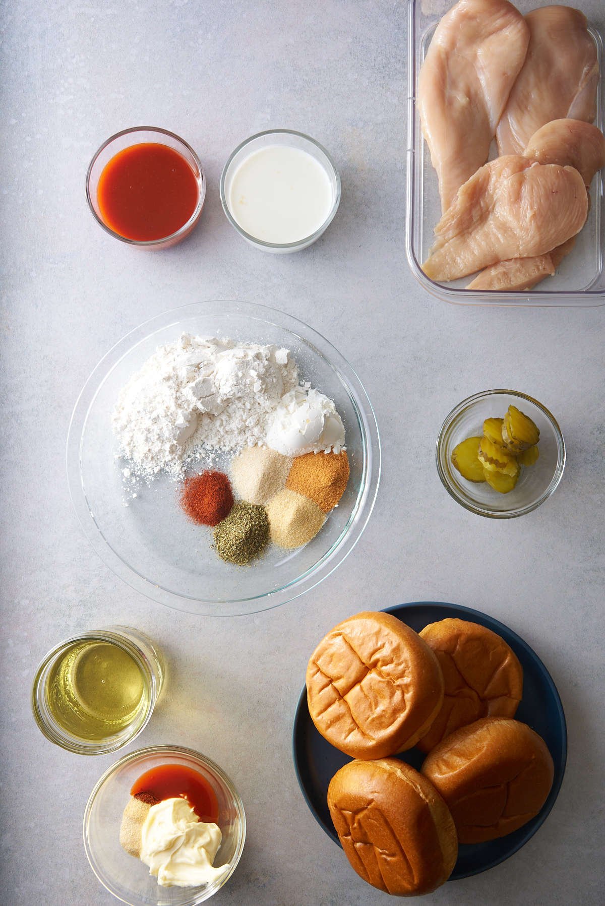 ingredients for fried chicken sandwich on table