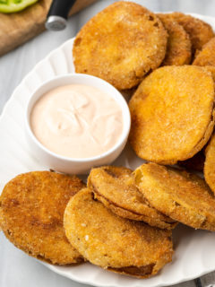 Plate of fried green tomatoes with bowl of comeback sauce