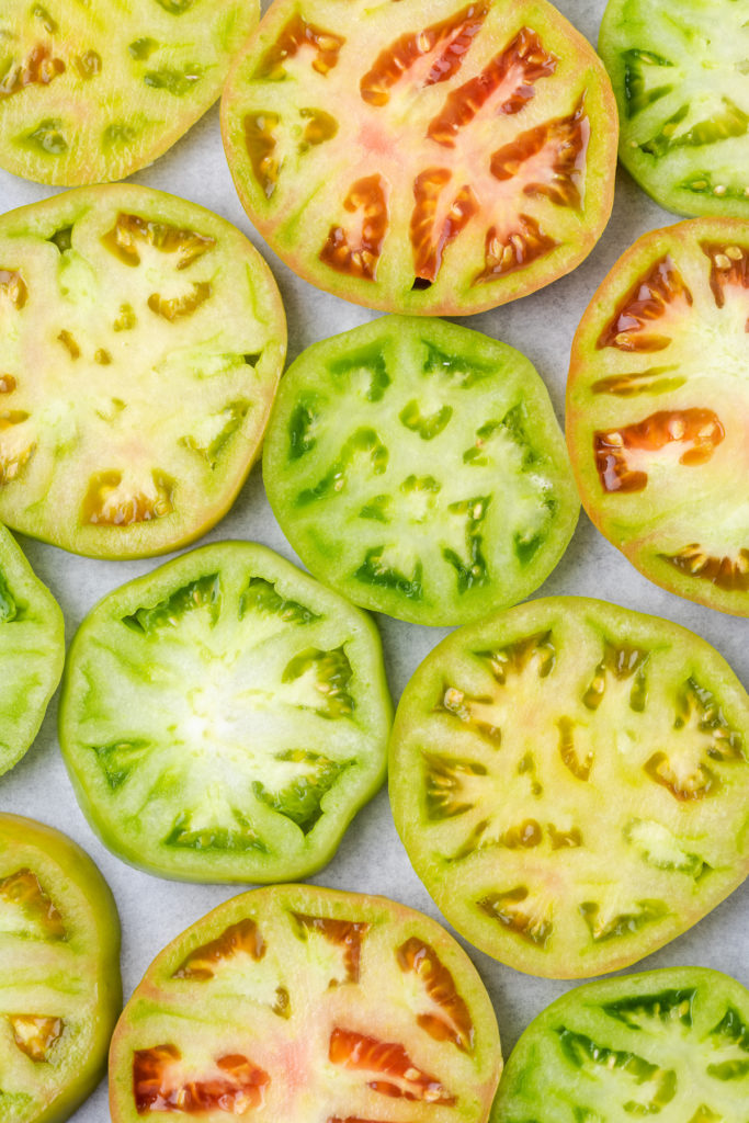 Overhead view of green tomato slices