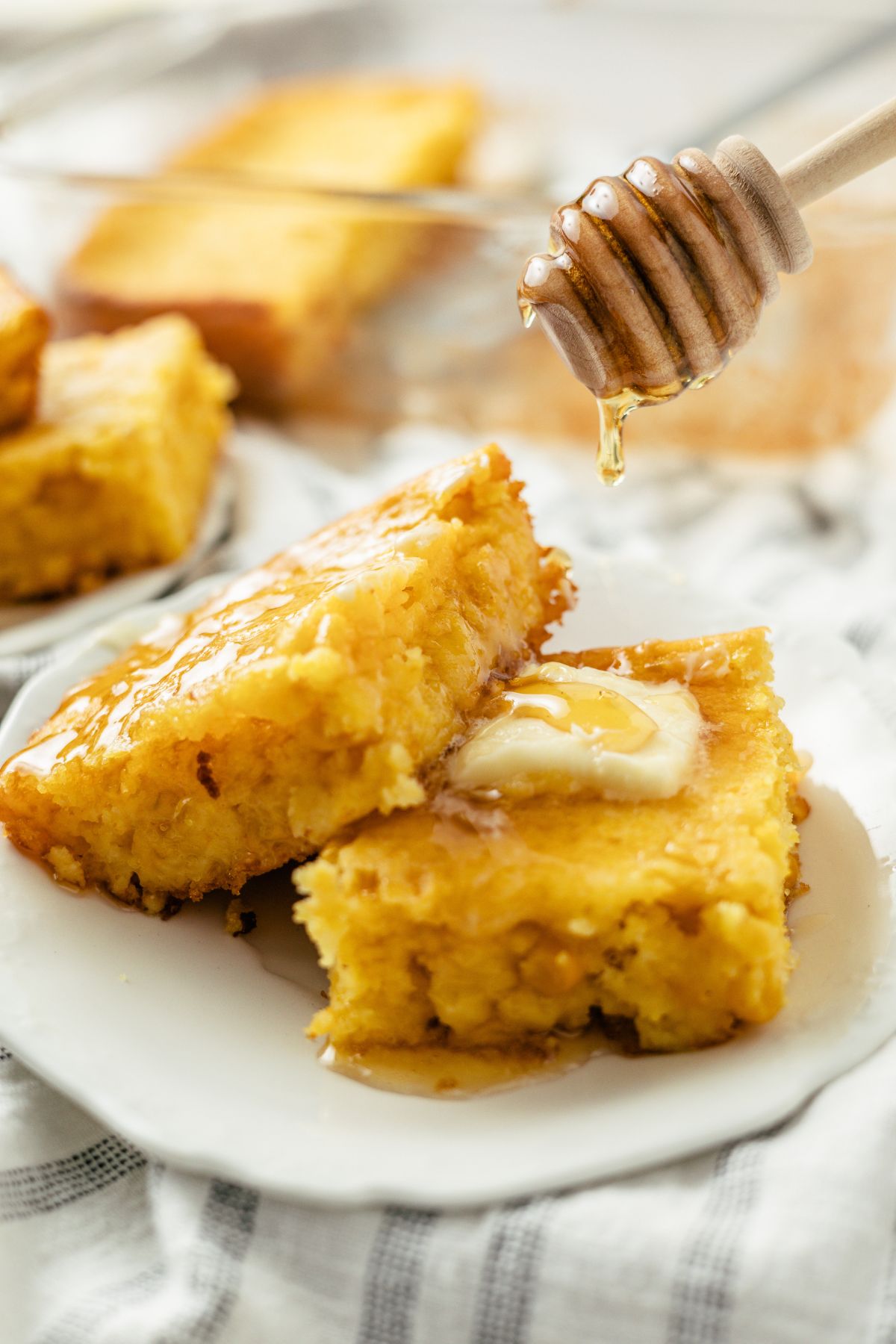 Jiffy Cornbread with Creamed Corn topped with butter and honey syrup