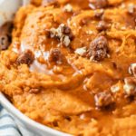 close-up shot of Whipped Sweet Potatoes topped with nutmegs on a large bowl