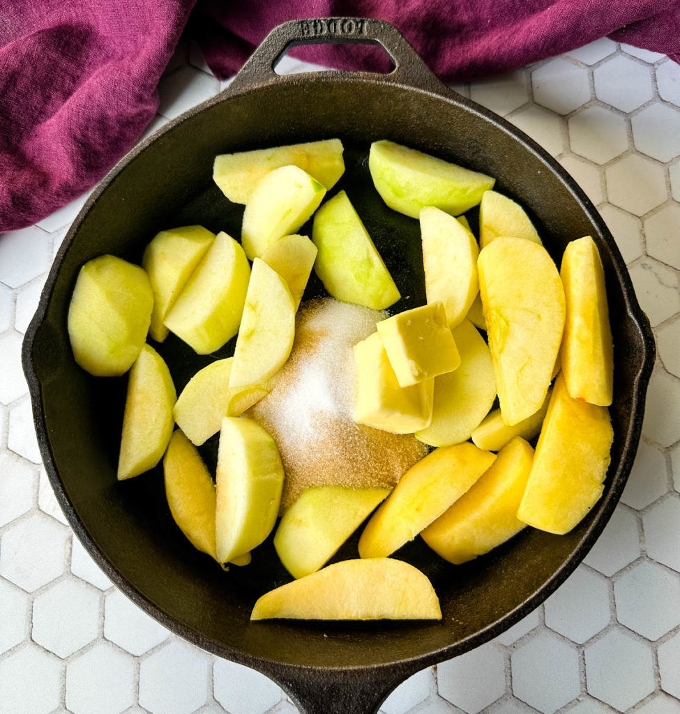 sliced apples, brown sweetener, and butter in a cast iron skillet