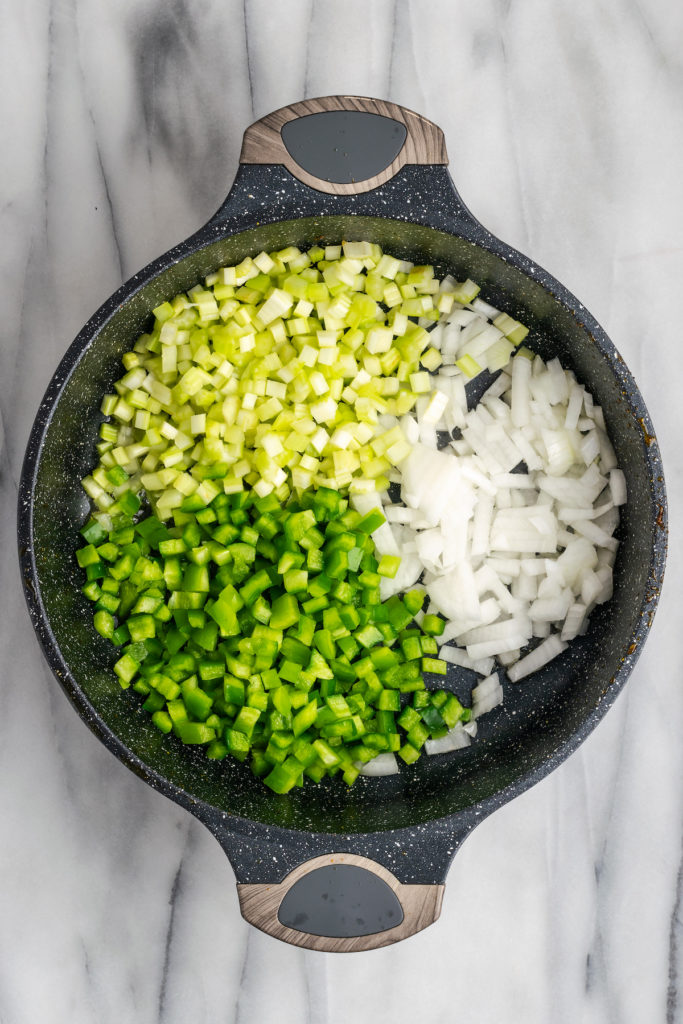 Onions, green pepper, and celery in pot