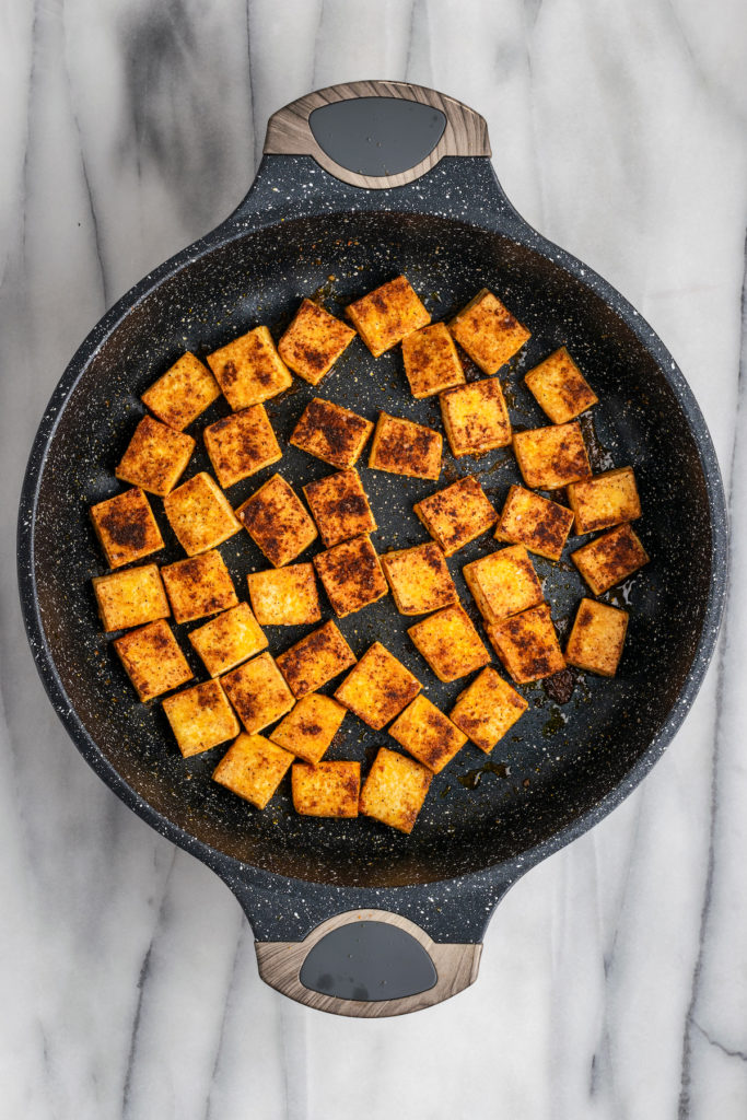 Overhead view of cooked tofu in pot