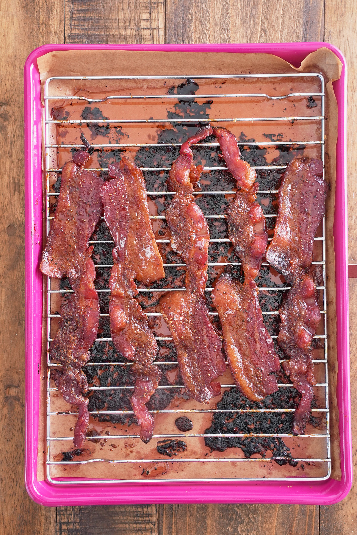 cooked candied bacon after it is removed from the oven and still on the baking rack