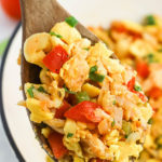 A spoon of saltfish and ackee up close