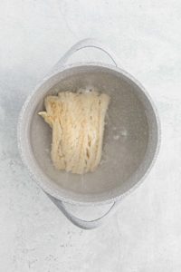 Cod in a pot of water being boiled