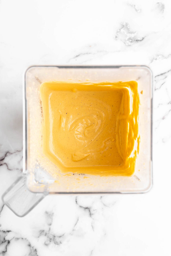 Overhead view of vegan cheese sauce in blender