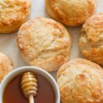 Insanely good Honey Butter Biscuits fresh from the oven with extra honey