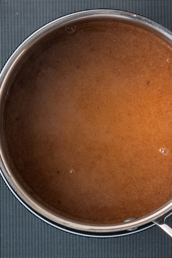 Overhead view of brown sugar coconut milk mixture in saucepan