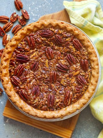 Decadent bourbon pecan pie ready to be sliced and enjoyed