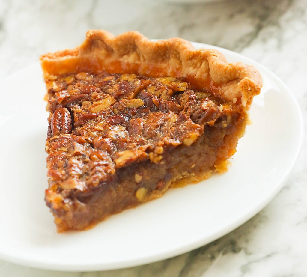 A slice of insanely delicious bourbon pecan pie