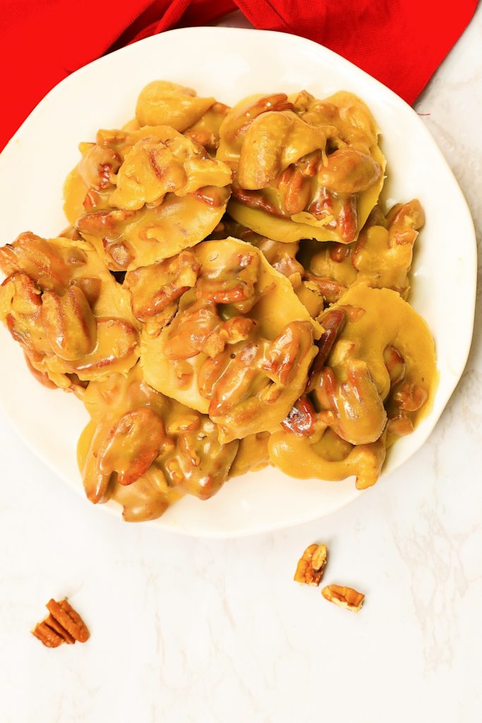 Pecan Pralines on a  white plate, cool and ready to enjoy