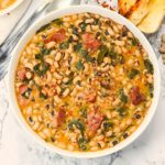 A delectable bowl of Black Eyed Peas and Collard Greens with freshly baked bread