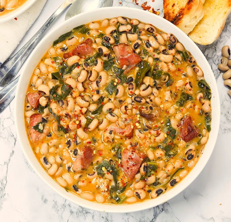 A delectable bowl of Black Eyed Peas and Collard Greens with freshly baked bread