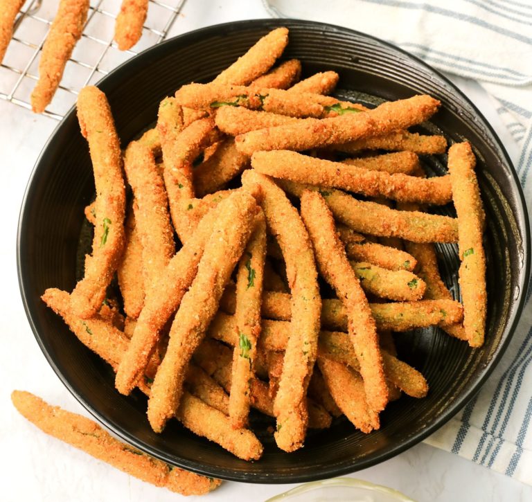 A plateful of Crispy Fried Green Beans ready to dip into fresh remoulade sauce