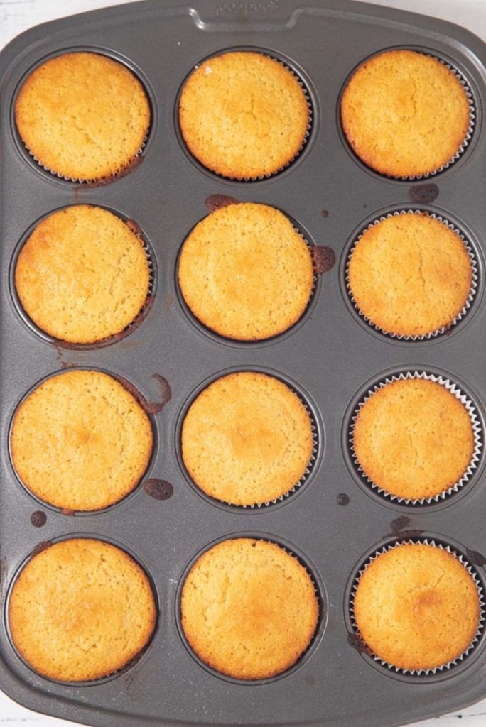 baked cornbread muffins in muffin tin
