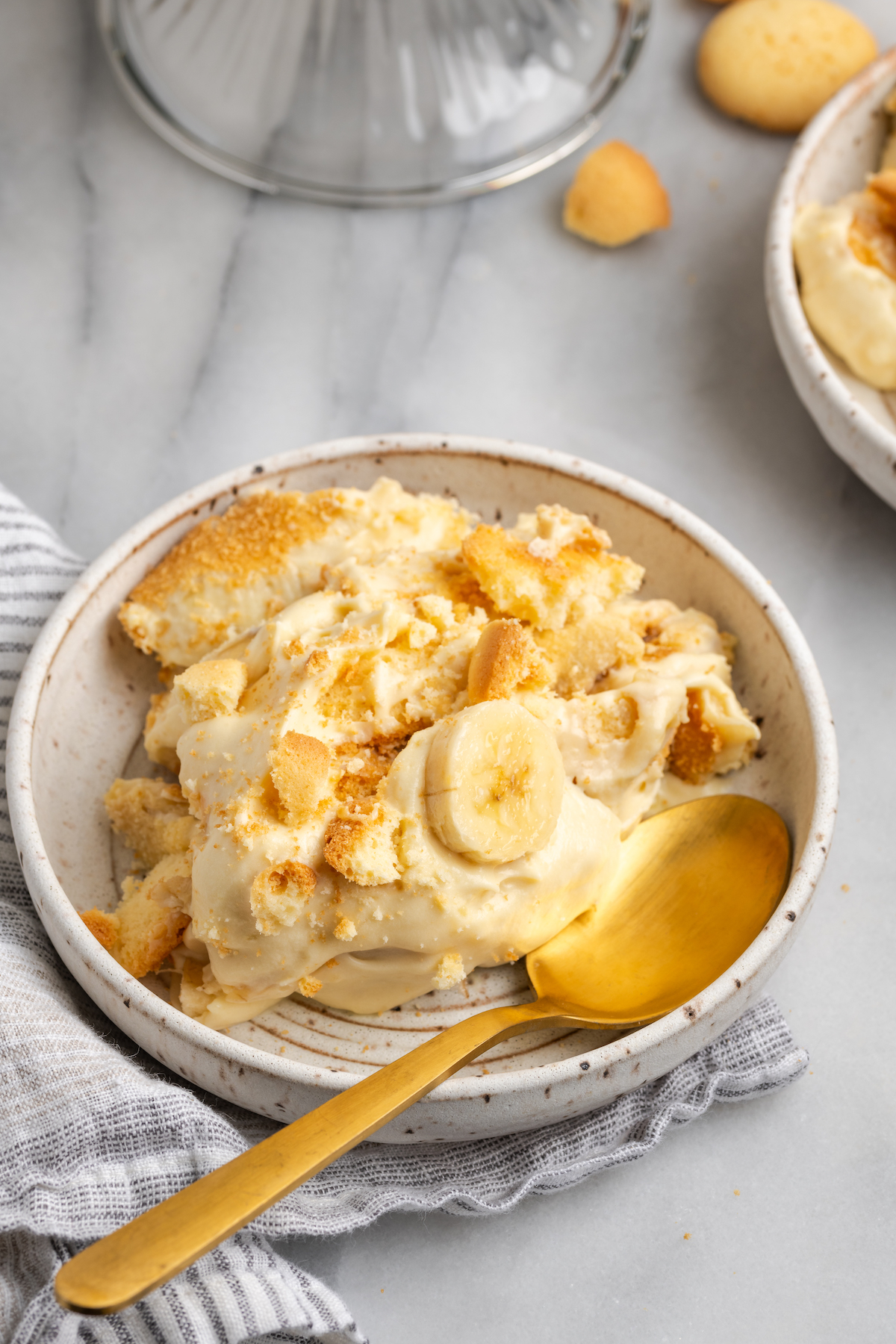 Creamy vegan banana pudding in bowl with spoon