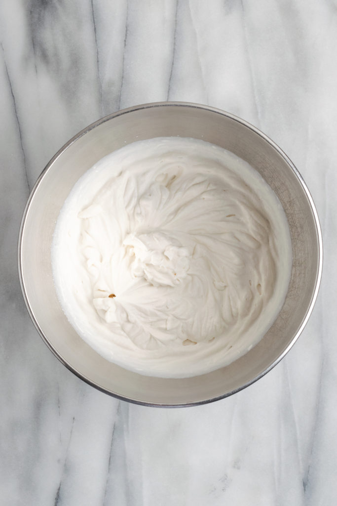 Overhead view of whipped vegan cream in bowl