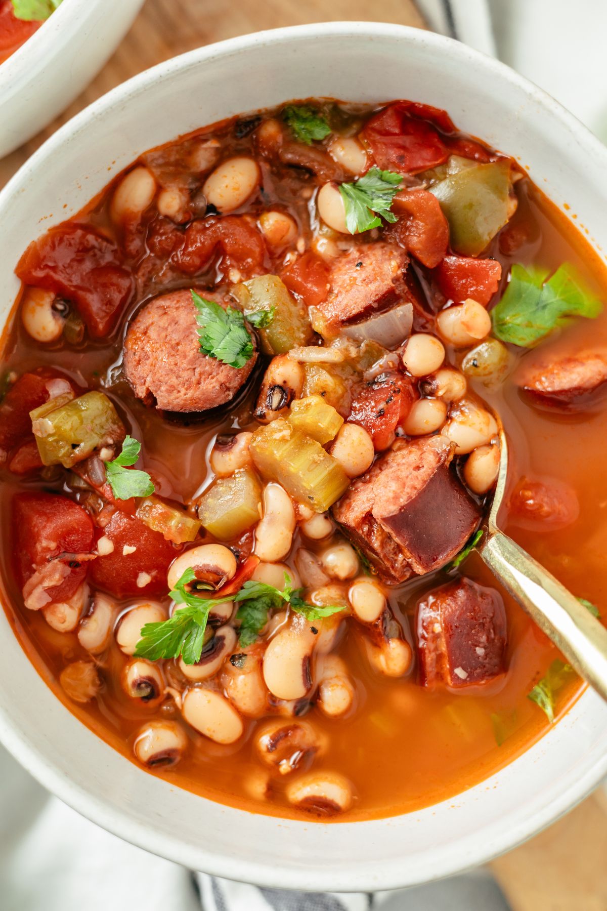 Bowl of hearty Black Eyed Pea Soup, showcasing a rich blend of beans, vegetables, and savory broth.