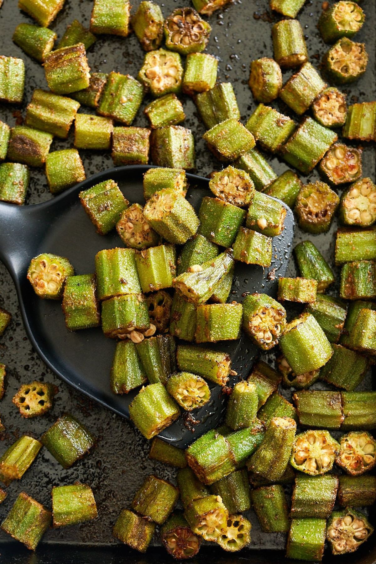 roasted okra with spatula picking it up