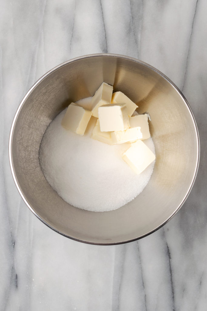 Overhead view of butter and sugar in bowl