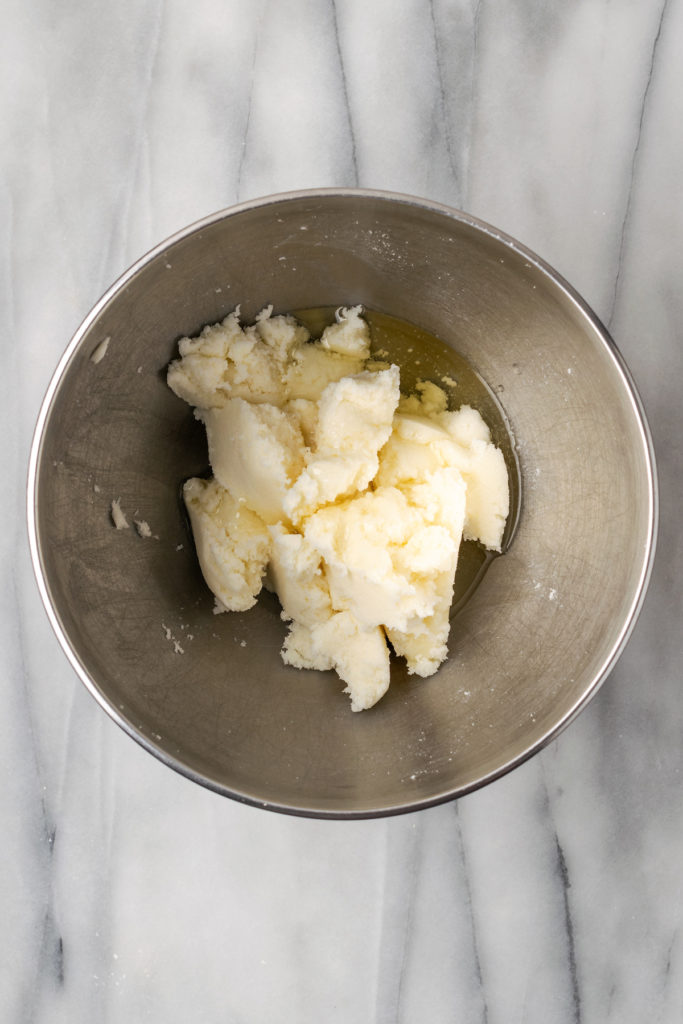 Overhead view of butter, sugar, and oil in bowl