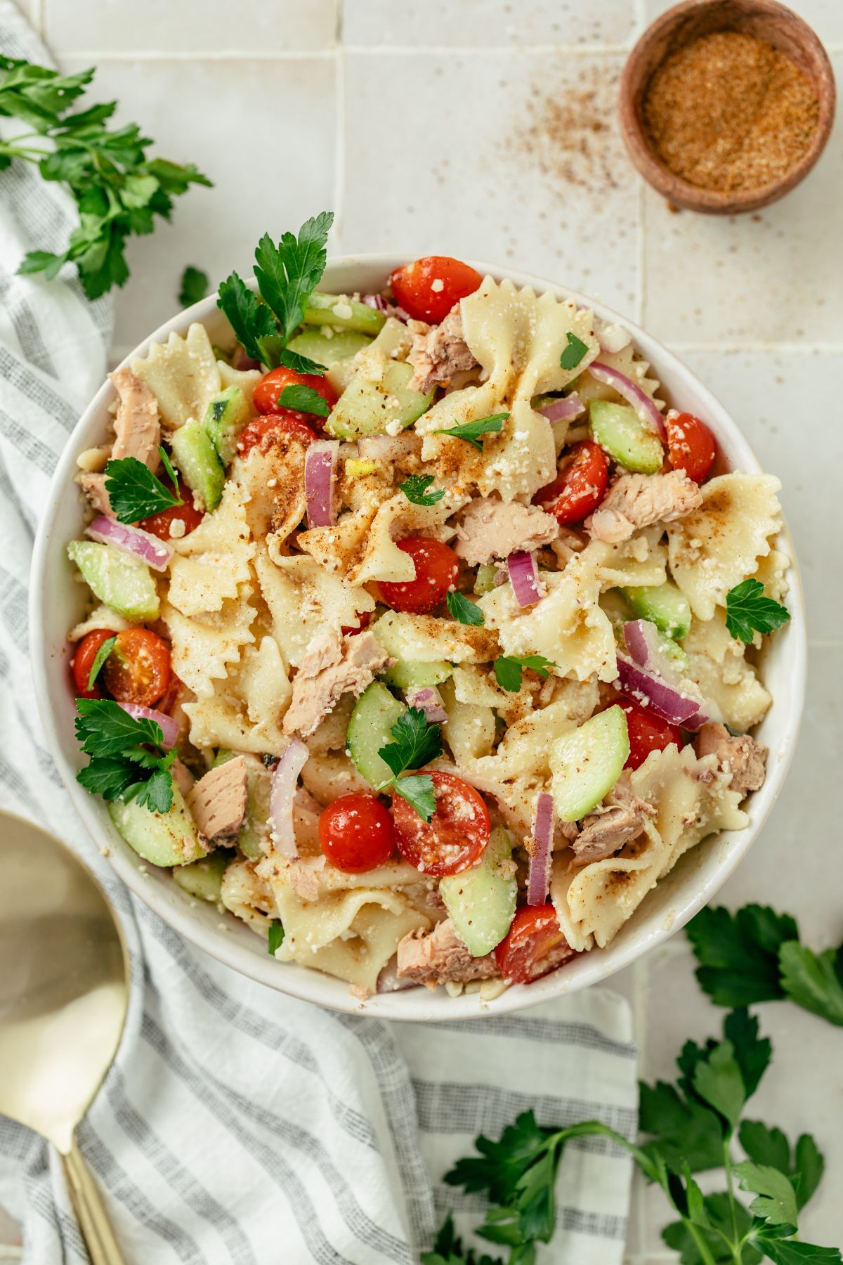 A colorful bowl of Canned Salmon Pasta Salad, featuring vibrant pasta, chunks of succulent salmon, and fresh vegetables, ready to tantalize taste buds
