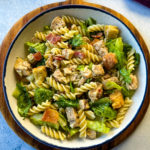 chicken pasta salad with bacon in a white bowl