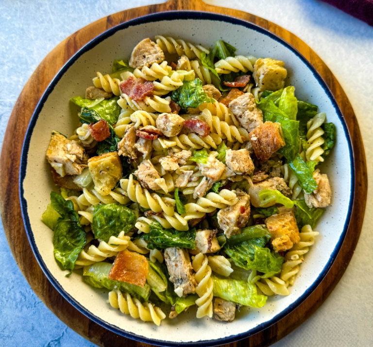 chicken pasta salad with bacon in a white bowl