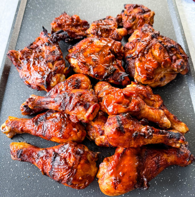 grilled BBQ chicken on a sheet pan