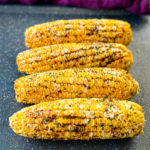 grilled corn on the cob on a sheet pan