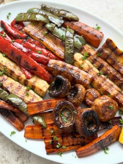 close up shot of grilled vegetables on a white plate