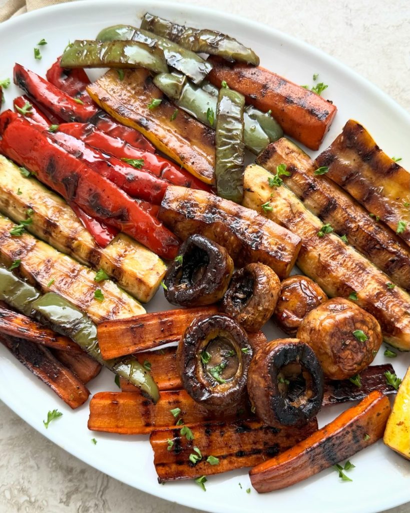 close up shot of grilled vegetables on a white plate