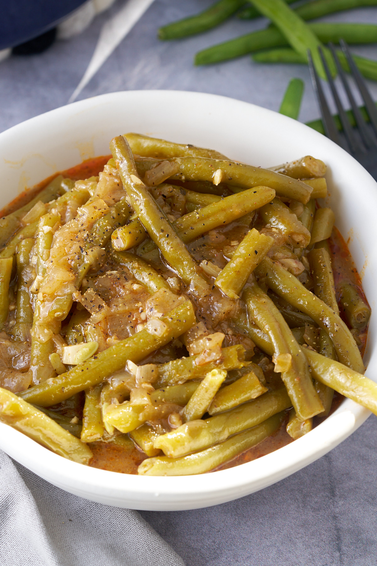 smothered green beans in white bowl