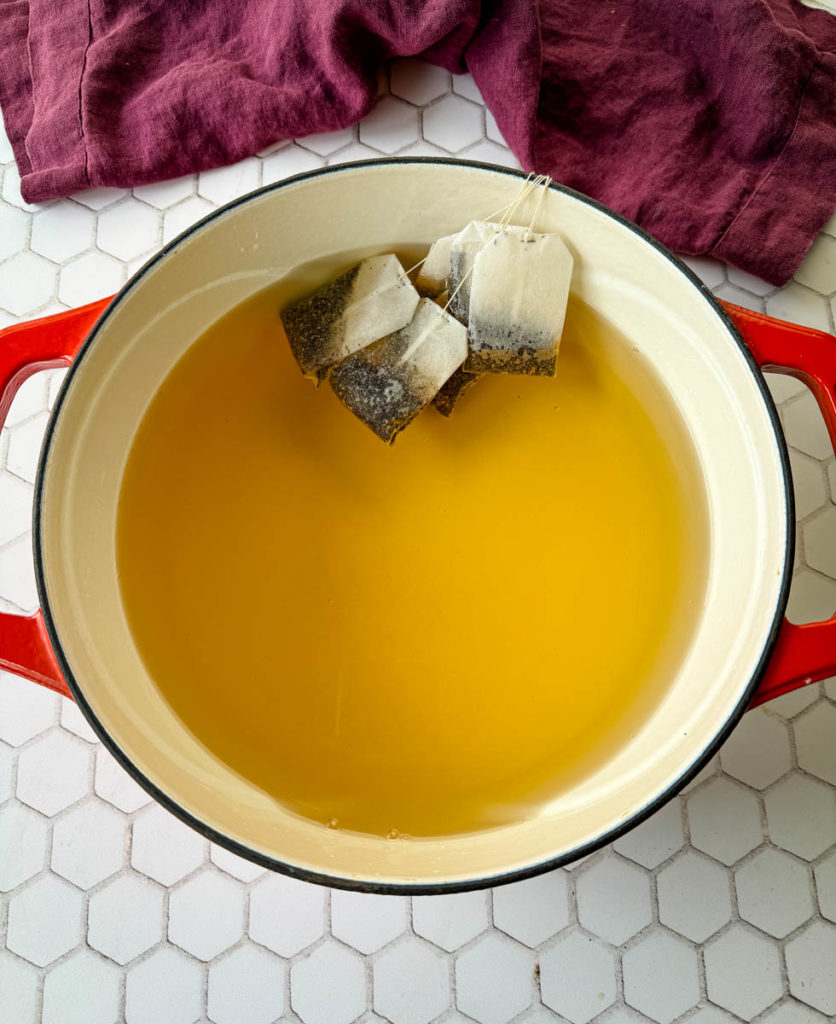 tea and teabags in a Dutch oven pot