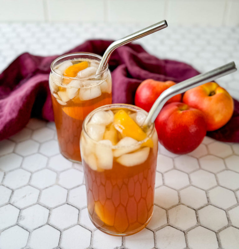 Southern sweet peach tea in glasses with a straw