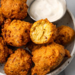 Southern hushpuppies on plate with dipping sauce